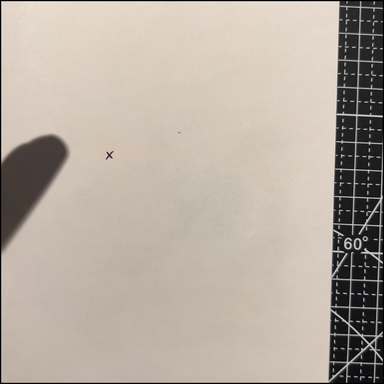 Simple circuit placed behind the paper. Drew an X to mark where the switch behind the paper was.