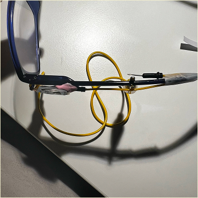 Aerial view of the circuit on the glasses, switch is placed halfway down the arm of the glasses.